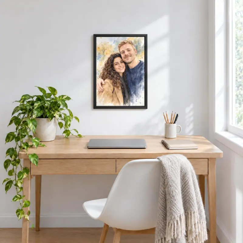 Koppelportret in aquarel op canvas in een zwarte baklijst, boven een bureau